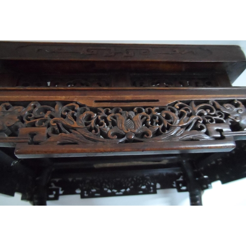 144 - Chinese extensively carved hardwood stand, circa 1900,

36 x 30 cm by 27cm high