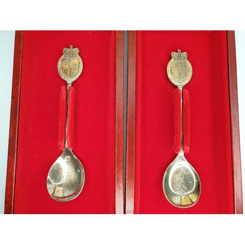 5A - Cased pair of silver spoons produced by the Library of Imperial History, London to commemorate the Q... 