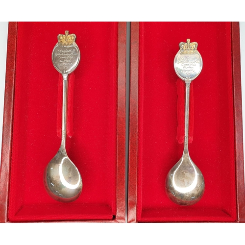 5A - Cased pair of silver spoons produced by the Library of Imperial History, London to commemorate the Q... 