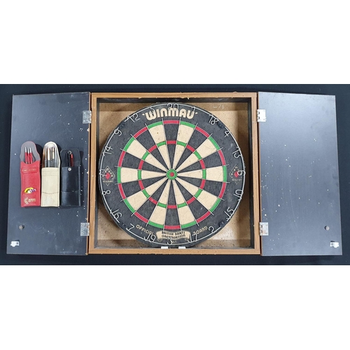 73 - Winmau dart board in holding case with darts and flights, (Qty)