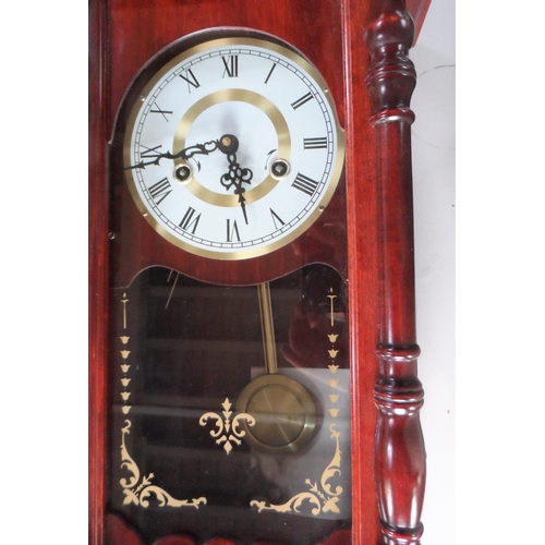 104 - Late 20thC wall hanging clock compete with key