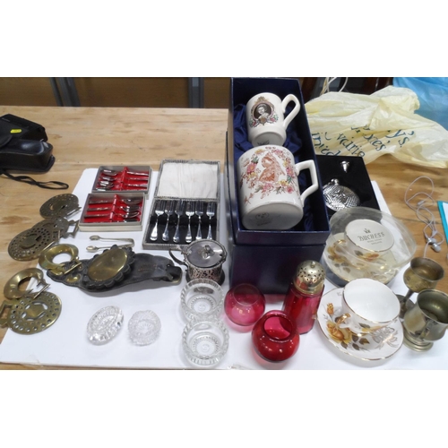 142 - Collection of home wares including old Cranberry glass items, horse brasses, flatware and a mug cele... 