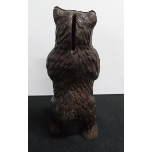 81 - Antique cast metal money box in the form of a Grizzly bear on its hind legs,

16 cm tall
