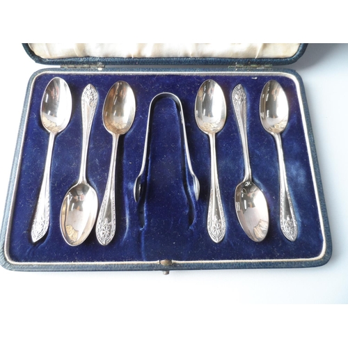 1 - Cased set of 6 London 1927 silver spoons together with a pair of later sugar nips,

83.5 grams silve... 