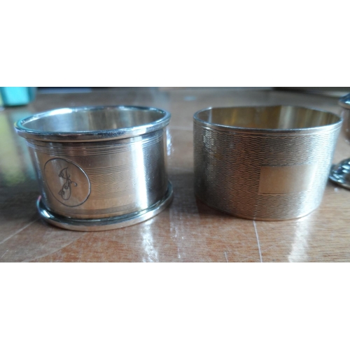 17 - Two silver napkin rings & a silver pepperette (3),

84.5 grams