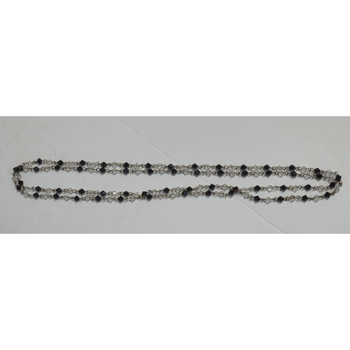 39 - 5 Jet and antique glass necklaces,

Longest necklace 122cm  shortest 34 cm