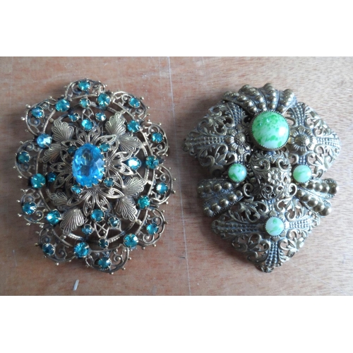 49 - Collection of 9 filigree metal & coloured stone brooches together with a mid 20thC metal sunburst br... 