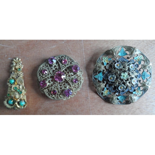 49 - Collection of 9 filigree metal & coloured stone brooches together with a mid 20thC metal sunburst br... 