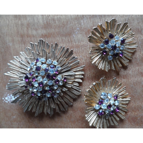 49 - Collection of 9 filigree metal & coloured stone brooches together with a mid 20thC metal sunburst br... 