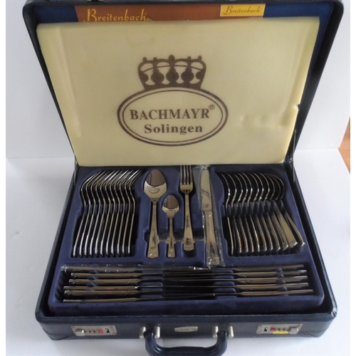 67 - Complete brief-cased set of Bachmayr, Solingen stainless steel cutlery