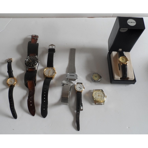 69 - Collection of wrist watches together with a small collection of coins (Qty)