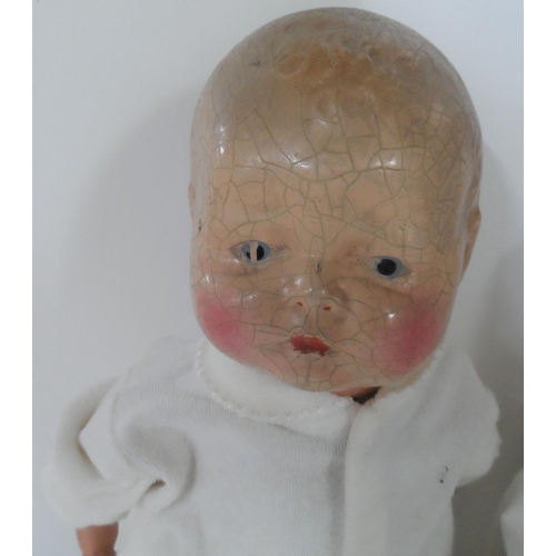 84 - Two antique dolls with hand painted porcelain heads (2),

Both indistinctly marked to back of neck