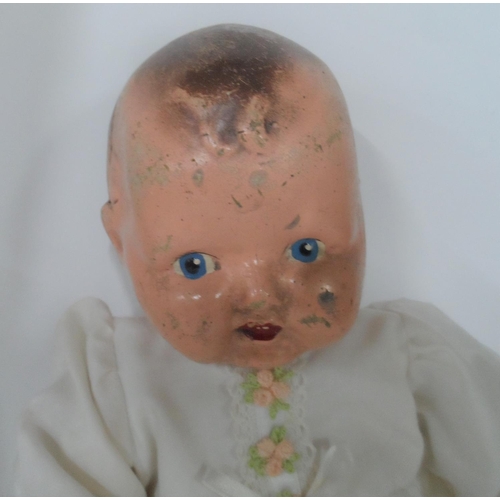 84 - Two antique dolls with hand painted porcelain heads (2),

Both indistinctly marked to back of neck