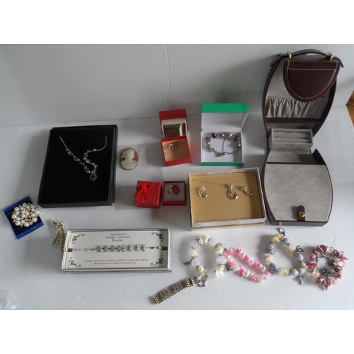 12 - Collection of mainly boxed modern costume jewellery together with a ladies travel jewellery case in ... 