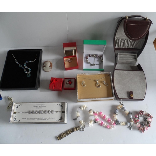 12 - Collection of mainly boxed modern costume jewellery together with a ladies travel jewellery case in ... 