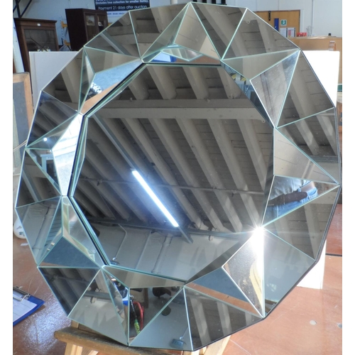 581 - Modern circular hall mirror with 3-D pyramid edging,

66 cm in diameter