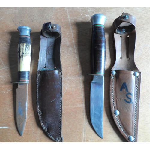 86 - Sabatier bowie style knife with sheath together with another (2)