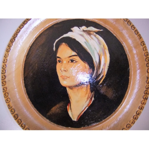 53 - Pair of unsigned, oil on wooden plate portraits of ladies (2),

Both plates measure 25 cm diameter