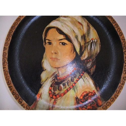 53 - Pair of unsigned, oil on wooden plate portraits of ladies (2),

Both plates measure 25 cm diameter