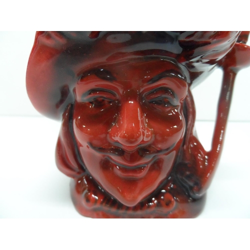 390 - Royal Doulton flambé glaze character jug, marked NOT PRODUCED FOR SALE,

11 cm tall