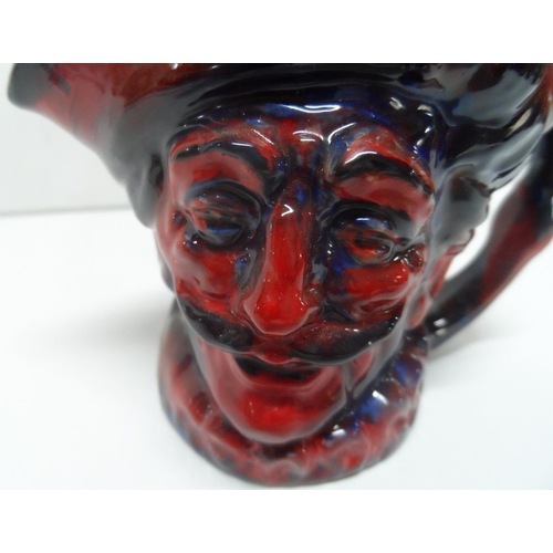 388 - Royal Doulton flambé glaze character jug, 

8.5 cm tall