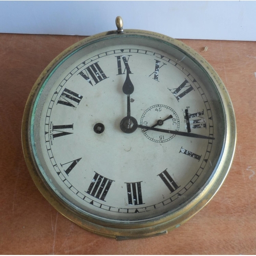 113 - British naval brass cased wall clock, traditionally believed by the current owners, who have owned t... 