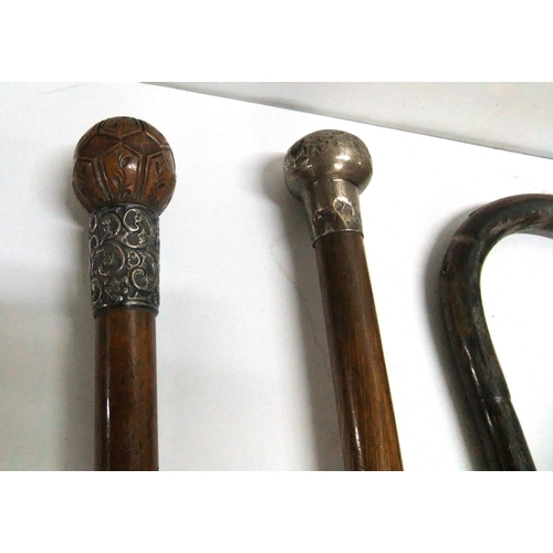 108 - 2 x silver topped/collared walking canes together with 2 other canes and 3 parasols