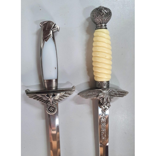 144 - Two German WW11 Nazi sheathed daggers (2)