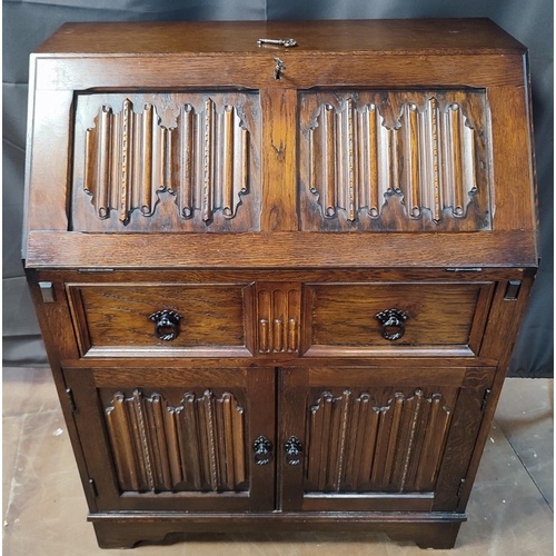 919 - A mid-century bureau with drop-front revealing red leather inlay, two drawers and compartments, with... 