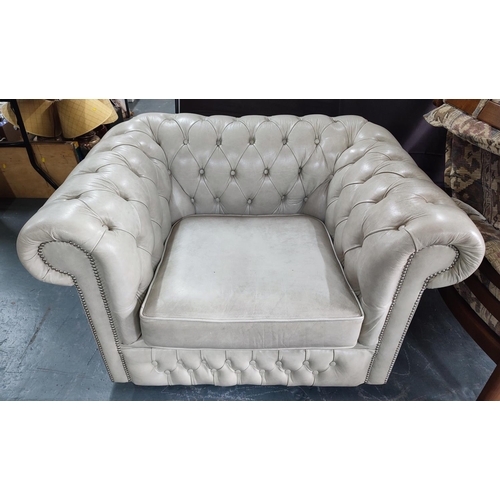 904 - A studded leather chesterfield style armchair