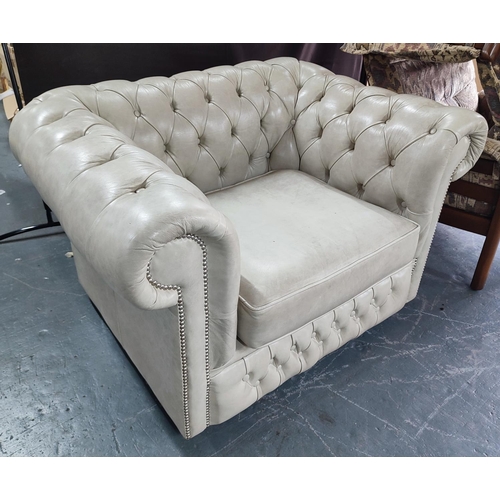 904 - A studded leather chesterfield style armchair