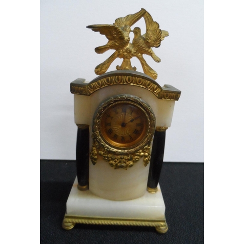 268 - Early 20thC, French Empire style mantle clock in Onyx & gilt metal,

15 cm tall