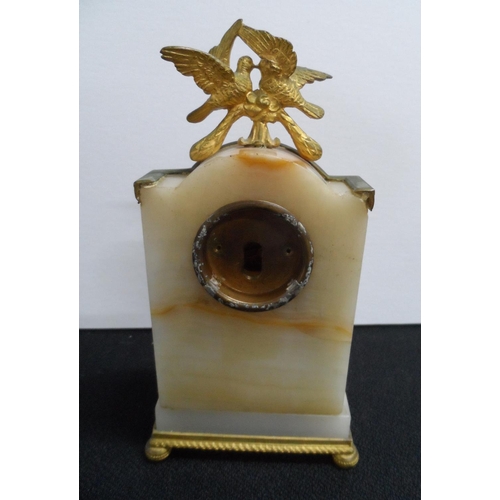 268 - Early 20thC, French Empire style mantle clock in Onyx & gilt metal,

15 cm tall