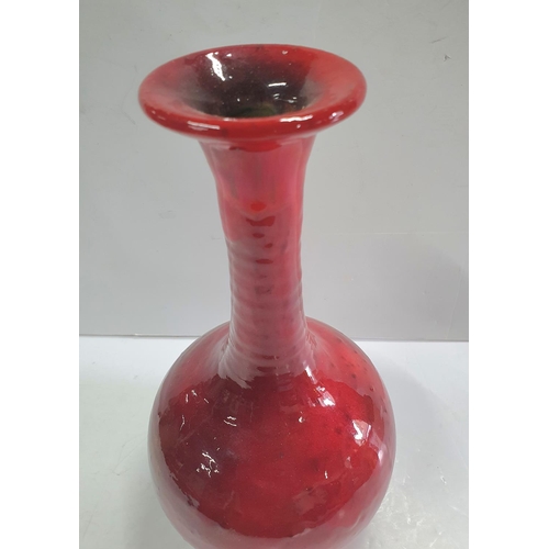 422 - Large unmarked red, thin necked ceramic vase,

29 cm tall