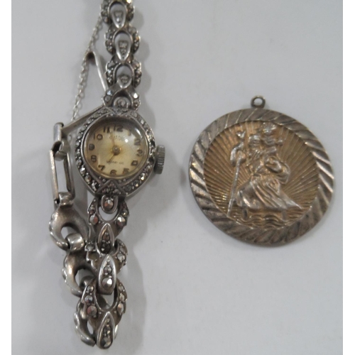 26 - Ladies vintage silver cocktail watch, silver St Christopher pendent and a Canadian folk art, pressed... 