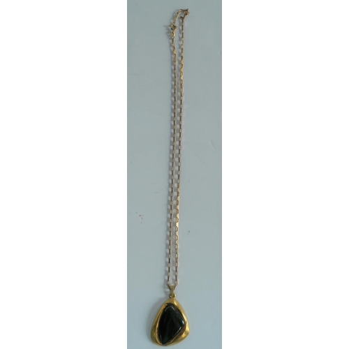 28 - Large 20thC New Zealand Jade pendent set in 14kt yellow gold on a 9ct yellow gold chain,

13.2 grams... 