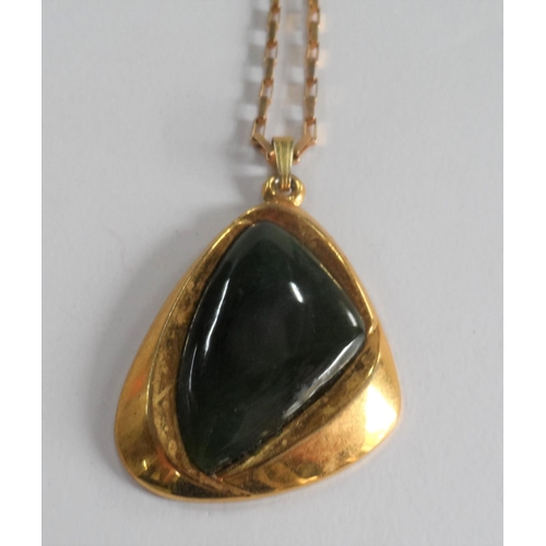 28 - Large 20thC New Zealand Jade pendent set in 14kt yellow gold on a 9ct yellow gold chain,

13.2 grams... 