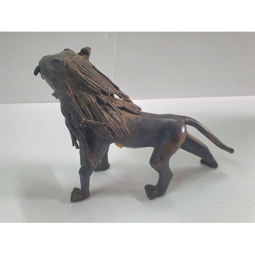 277 - Unsigned African bronze Lion,

20cm long          1 Kg