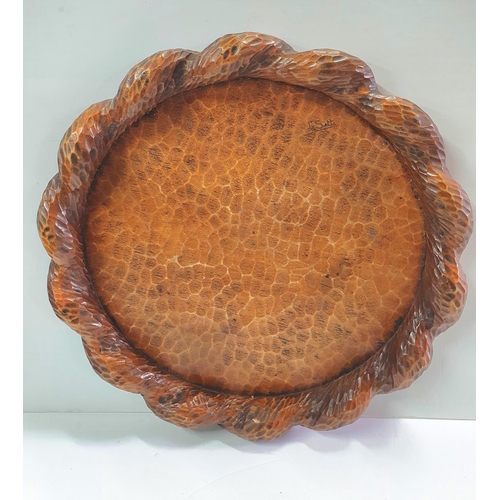 194 - Early 20thC, hand-carved wooden circular tray signed G Sette to base,

40 cm diameter