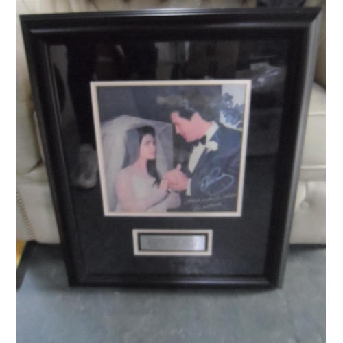 198 - Framed Elvis Presley photo of his wedding day with a signature and inscription etc,

Please note - w... 