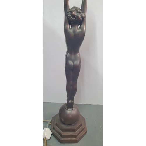 221 - Modern, tall, Art Deco style bronze standing lamp depicting a young naked lady holding the lamp abov... 