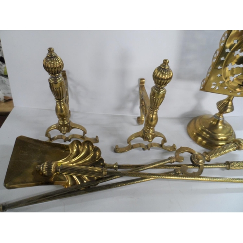 228 - Antique brass fire dogs and similar brass fire companion set