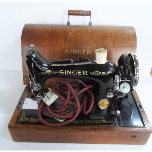 230 - Antique Singer sewing machine complete with original wooden cover