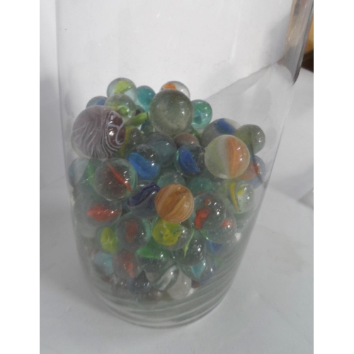 239 - Glass vase full of marbles