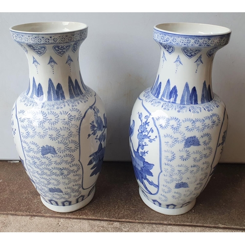 406 - Pair of 20thC large Chinese blue & white vases (2),

Both measure 46 cm tall