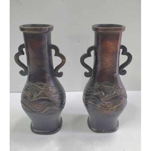 285 - Small, unmarked pair of Oriental bronze vases with bird motif decoration (2),

18 cm tall