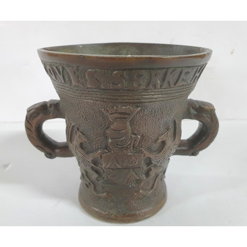 275 - Two handled 20thC bronze cup with all-round inscription and decoration,

12 cm tall           1250 g... 