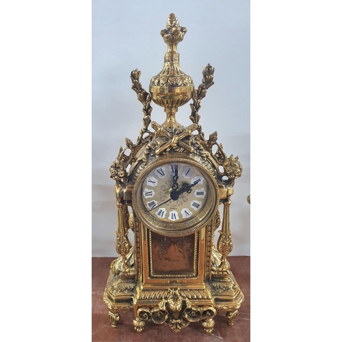 270 - Ornately cast, unmarked, 20thC French style, enamelled faced mantle clock flanked by ornate brass ca... 