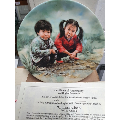 56 - Boxed Chinese wall plate entitled 