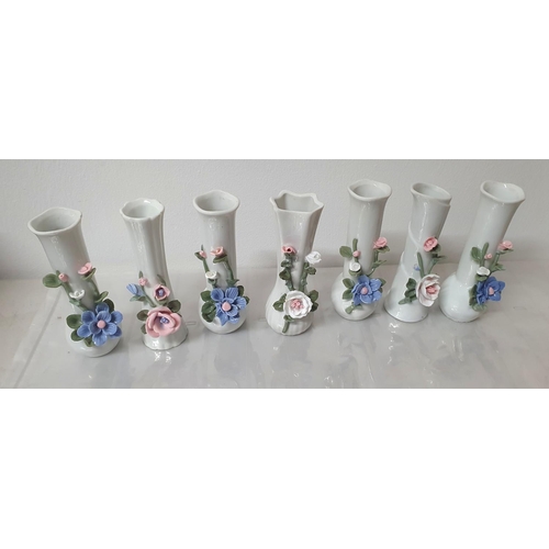 122 - Seven small ceramic bud vases (7)